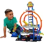 Miniatura de Hot Wheels City Mega Garage JBM74 Multicolor con Elevador, Pista de Tres Niveles y Helicóptero, Capacidad para 36 Autos 1:64, Incluye 1 Auto Die-Cast y 1 Helicóptero Plástico, Serie Hot Wheels City, para Niños +4 Años, Dimensiones 13.3 x 55.9 x 33 cm
